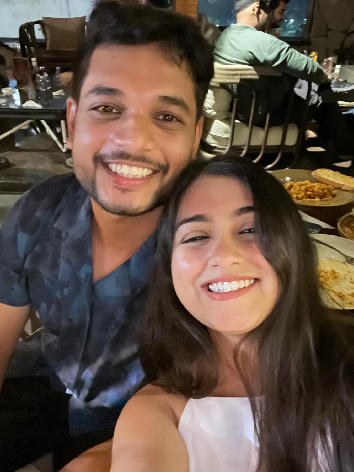 Harshit and Kavya sharing a happy restaurant date